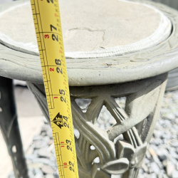 Lot 654: Vintage cast aluminum tri-leg plant stand with floral motif and stone/tile inset top, garden fern & flower design