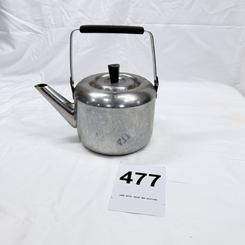 Lot 477: Vintage Revere Ware aluminum tea kettle with  Black plastic or bakelite handle, made in Korea