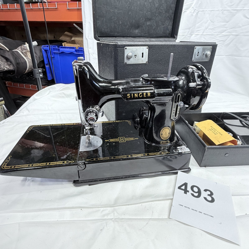 Lot 493: Vintage Singer Featherweight 221 portable electric sewing machine with black case, foot pedal, bobbins & accessories