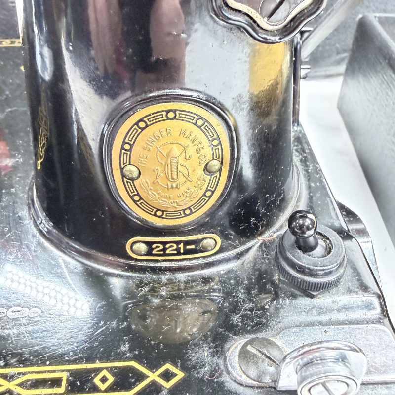 Lot 493: Vintage Singer Featherweight 221 portable electric sewing machine with black case, foot pedal, bobbins & accessories