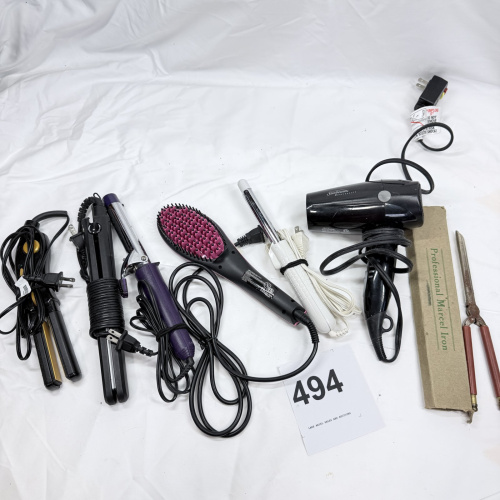 Lot 494: Vintage hair styling tool lot: Sunbeam Hospitality dryer, Simply Straight brush, curling irons, flat irons, and vintage Professional Marcel Iron in box