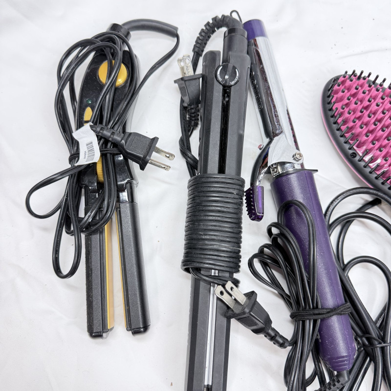Lot 494: Vintage hair styling tool lot: Sunbeam Hospitality dryer, Simply Straight brush, curling irons, flat irons, and vintage Professional Marcel Iron in box