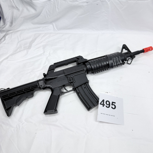 Lot 495: Airsoft M4A1 style spring/AEG rifle replica, "Made in China," red safety muzzle tip