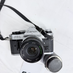 Lot 534: Vintage Canon AE-1 Program 35mm SLR camera with 28mm f/2.8 lens and additional lens