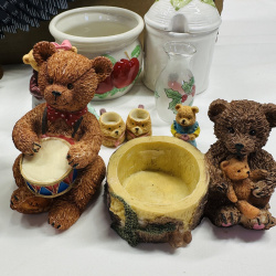 Lot 551: Mixed lot: resin bear/eagle figurines, apple-motif ceramic crock, honey pot, holly glass bud vase, wooden eagle wall decor, thimble