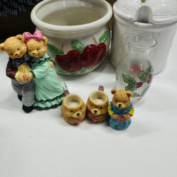 Lot 551: Mixed lot: resin bear/eagle figurines, apple-motif ceramic crock, honey pot, holly glass bud vase, wooden eagle wall decor, thimble