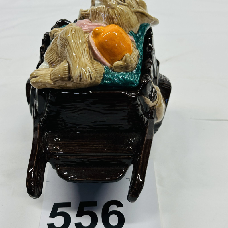 Lot 556: Majolica-style rabbit sleeping in wheelbarrow figural planter/dish, sculpted ceramic
