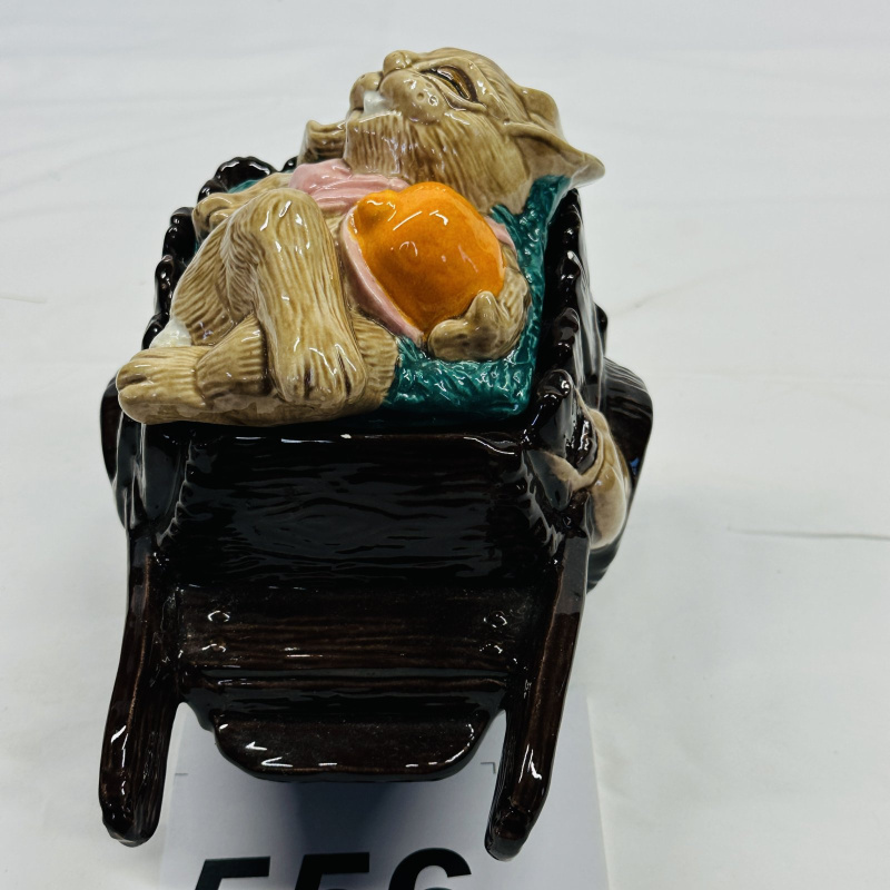 Lot 556: Majolica-style rabbit sleeping in wheelbarrow figural planter/dish, sculpted ceramic