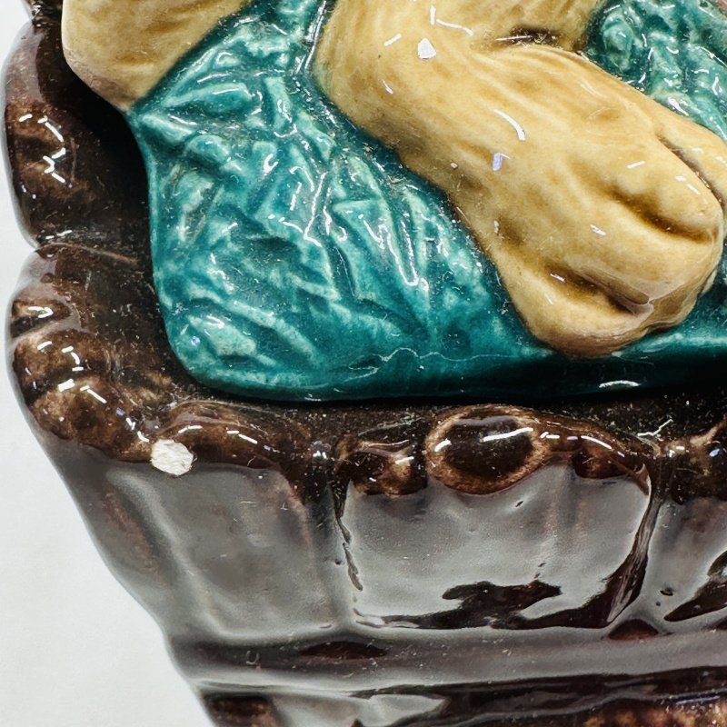 Lot 556: Majolica-style rabbit sleeping in wheelbarrow figural planter/dish, sculpted ceramic