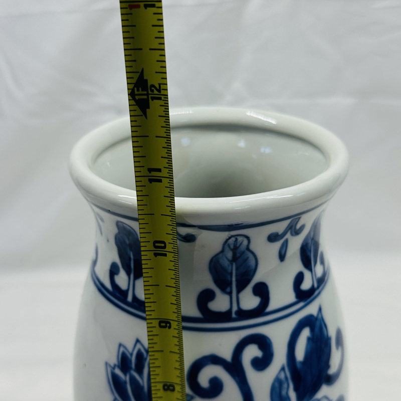 Lot 557: Blue and white porcelain vase, hand-painted lotus flower and scroll design, footed baluster form