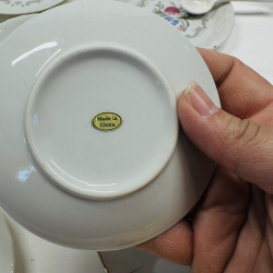Lot 558: Vintage Japan porcelain floral demitasse cup, saucers & mini plates lot with gold trim, 9 pieces