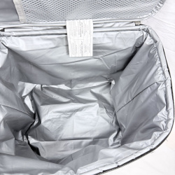 Lot 572: Black insulated soft-sided cooler bag with front pocket, "M" logo emblem