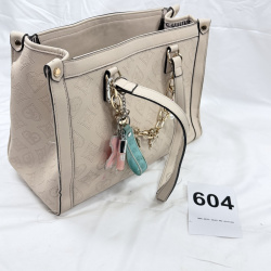 Lot 604: Juicy Couture cream embossed monogram leather tote bag with chain-link handle and charm keyring, includes lipstick stain