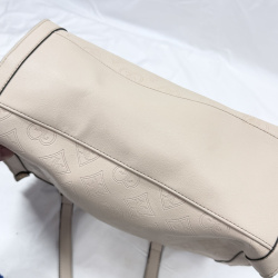 Lot 604: Juicy Couture cream embossed monogram leather tote bag with chain-link handle and charm keyring, includes lipstick stain