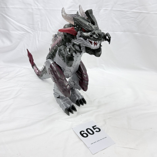 Lot 605: Silver and black robotic dragon/dinosaur action figure toy, articulated with horns and armor plating