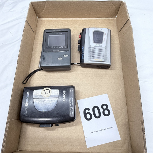 Lot 608: Vintage electronics lot: Optimus LCD Color Television, Sony VOR handheld cassette recorder, Sony Walkman FM/AM cassette player