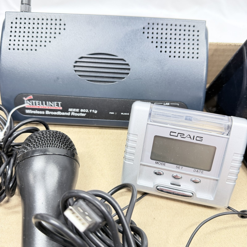 Lot 610: Electronics lot: Intellinet Wireless Broadband Router, Craig digital clock, 2x microphones, and Amazon Echo Show smart display