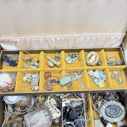 Lot 631: Vintage gold-tone three-tier jewellery box with costume jewellery collection, watches, necklaces, brooches and cameos