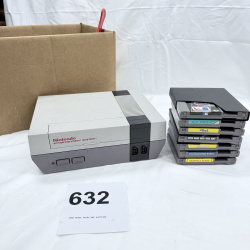 Lot 632: Vintage Nintendo Entertainment System (NES) console with controller, Zapper light gun, and 7 games including Super Mario Bros. 3