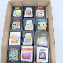 Lot 634: 1980s Atari 2600 game cartridge lot (12): Pac-Man, Ms. Pac-Man, Q*bert, Defender, Star Wars, Atlantis, Super Breakout, Tutankham, Journey Escape