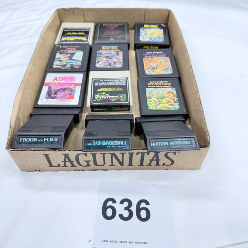 Lot 636: Vintage Atari 2600 game cartridge lot (12): Pac-Man, Adventure, Combat, Venture, Indy 500, Circus Atari, Maze, E.T., Time Pilot, Frogs and Flies, Super Challenge Baseball, Armor Ambush