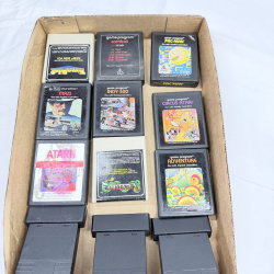 Lot 636: Vintage Atari 2600 game cartridge lot (12): Pac-Man, Adventure, Combat, Venture, Indy 500, Circus Atari, Maze, E.T., Time Pilot, Frogs and Flies, Super Challenge Baseball, Armor Ambush