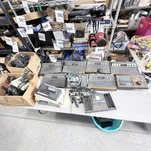 Lot 642: Vintage Atari 2600/CX2600 & ColecoVision console lot with Sears Tele-Games, controllers, joysticks and Coleco Roller Controller