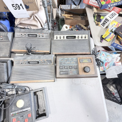 Lot 642: Vintage Atari 2600/CX2600 & ColecoVision console lot with Sears Tele-Games, controllers, joysticks and Coleco Roller Controller