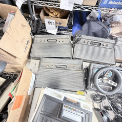 Lot 642: Vintage Atari 2600/CX2600 & ColecoVision console lot with Sears Tele-Games, controllers, joysticks and Coleco Roller Controller