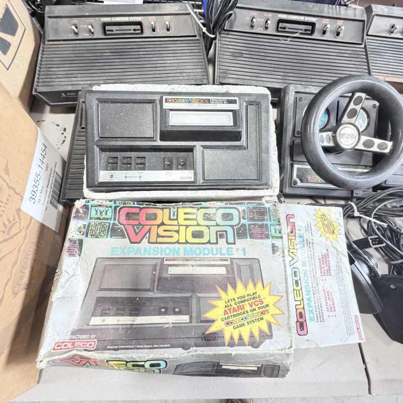 Lot 642: Vintage Atari 2600/CX2600 & ColecoVision console lot with Sears Tele-Games, controllers, joysticks and Coleco Roller Controller