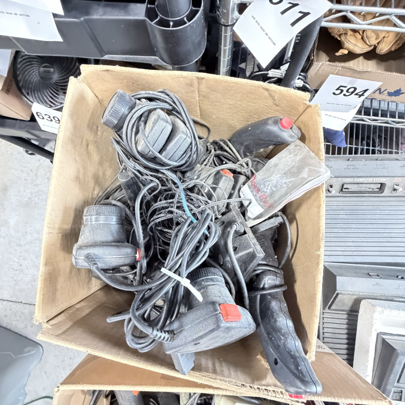 Lot 642: Vintage Atari 2600/CX2600 & ColecoVision console lot with Sears Tele-Games, controllers, joysticks and Coleco Roller Controller