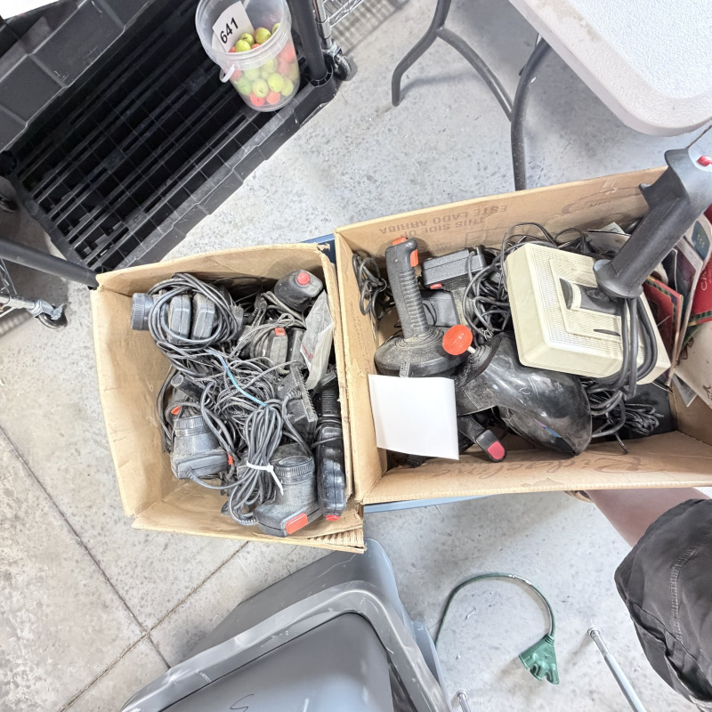 Lot 642: Vintage Atari 2600/CX2600 & ColecoVision console lot with Sears Tele-Games, controllers, joysticks and Coleco Roller Controller