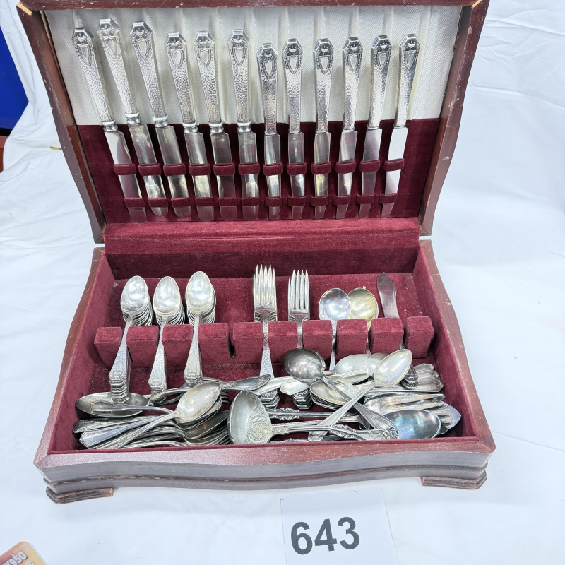 Lot 643: Vintage silverplate flatware canteen, mixed patterns, in fitted wooden chest with velvet lining, service for 12 plus extra serving pieces