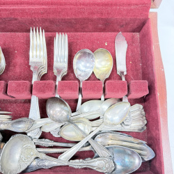 Lot 643: Vintage silverplate flatware canteen, mixed patterns, in fitted wooden chest with velvet lining, service for 12 plus extra serving pieces