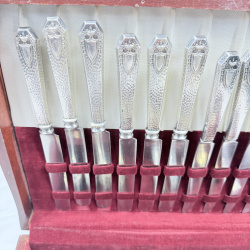 Lot 643: Vintage silverplate flatware canteen, mixed patterns, in fitted wooden chest with velvet lining, service for 12 plus extra serving pieces