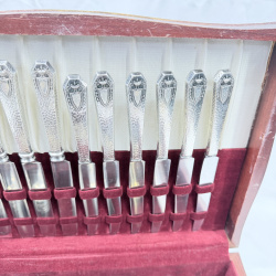 Lot 643: Vintage silverplate flatware canteen, mixed patterns, in fitted wooden chest with velvet lining, service for 12 plus extra serving pieces