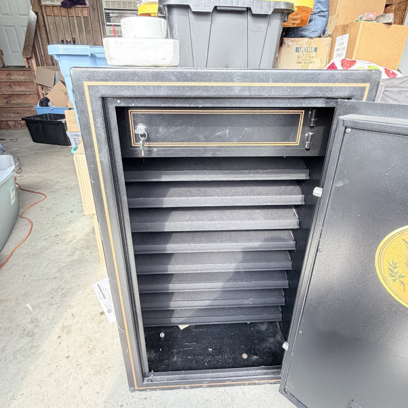 Lot 659: "World Monetary Exchange Reserve" Safe With Keys and Code