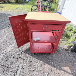 Lot 660: Test Rite rolling tool cabinet with locking drawer, pegboard door, and particle board top on casters