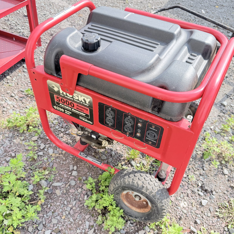 Lot 661: Husky 5000 Running Watts/6250 Starting Watts portable gas generator, Subaru engine, with cracked frame