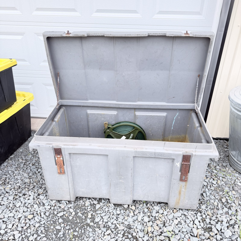 Lot 663: Craftsman gray poly job box truck tool chest with tray, contents included (hose reel, chain, circular saw)